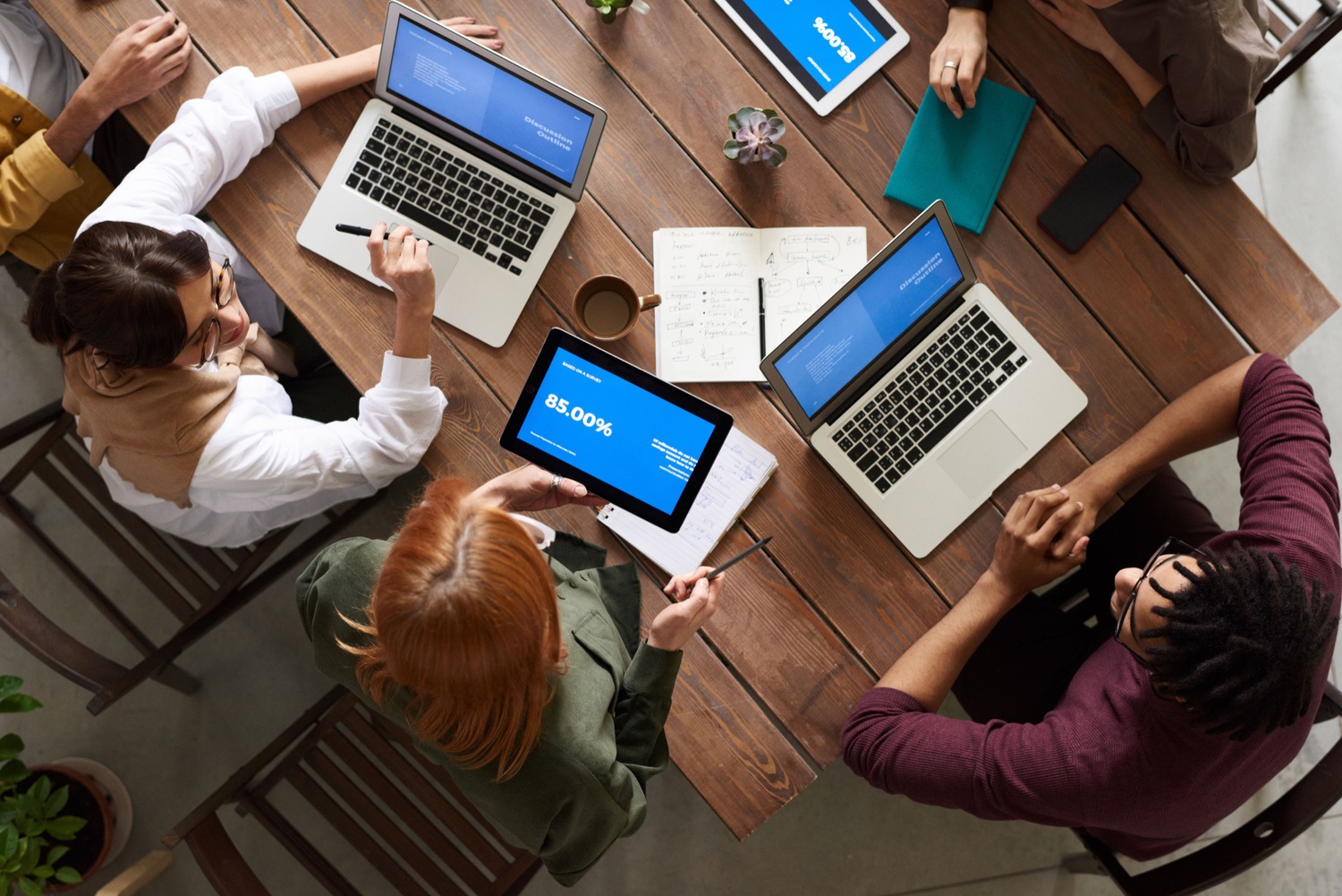 Team members gathered discussing solutions.